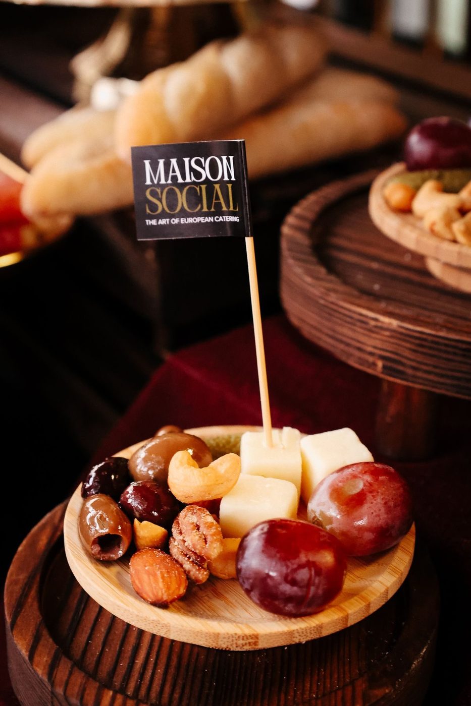 Maison Social flag in a cheese and fruit board