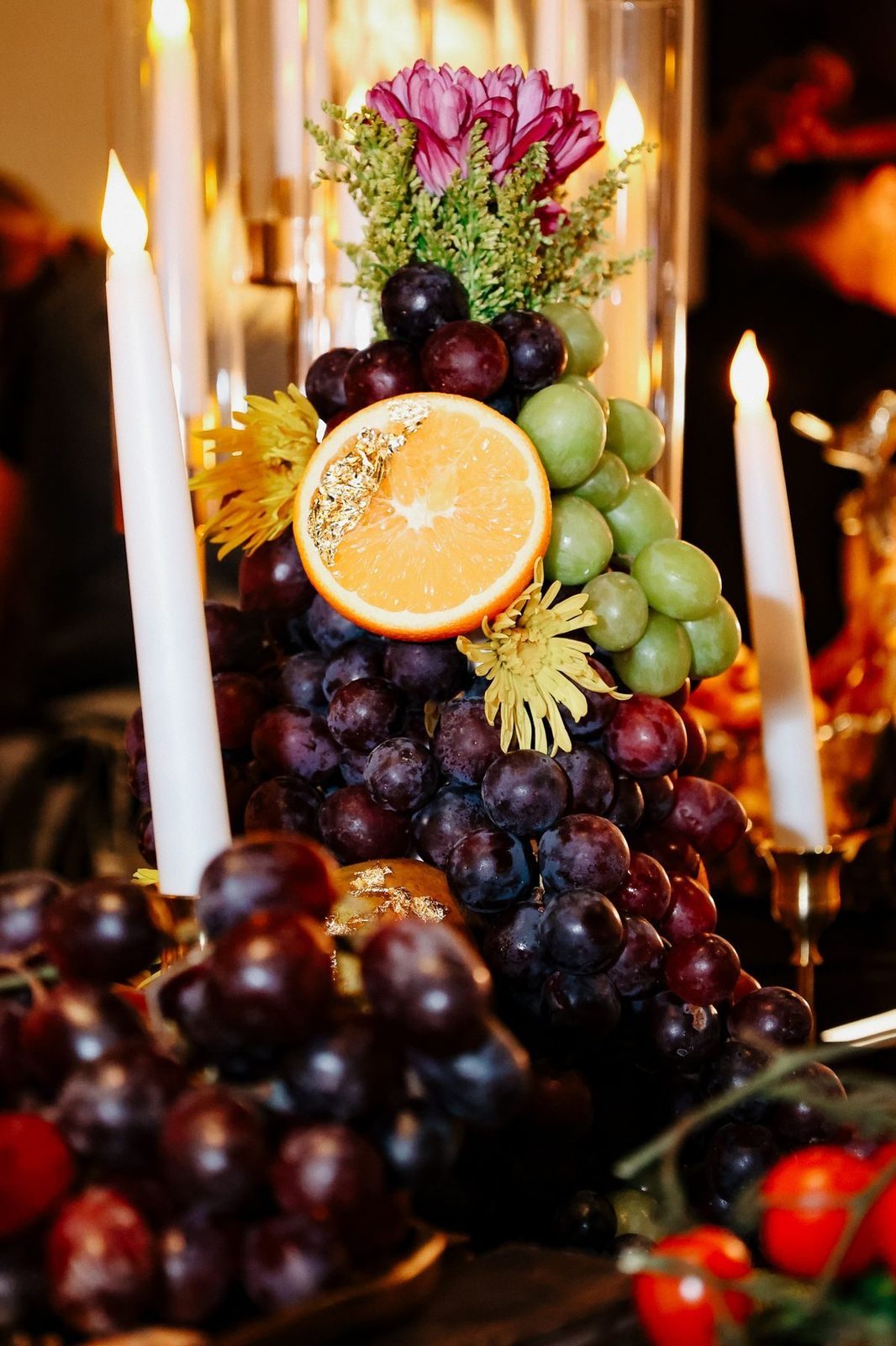 Grapes, citrus and candles on a grazing display