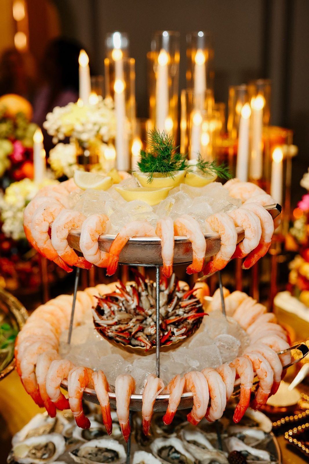 Tiered seafood display under candlelight