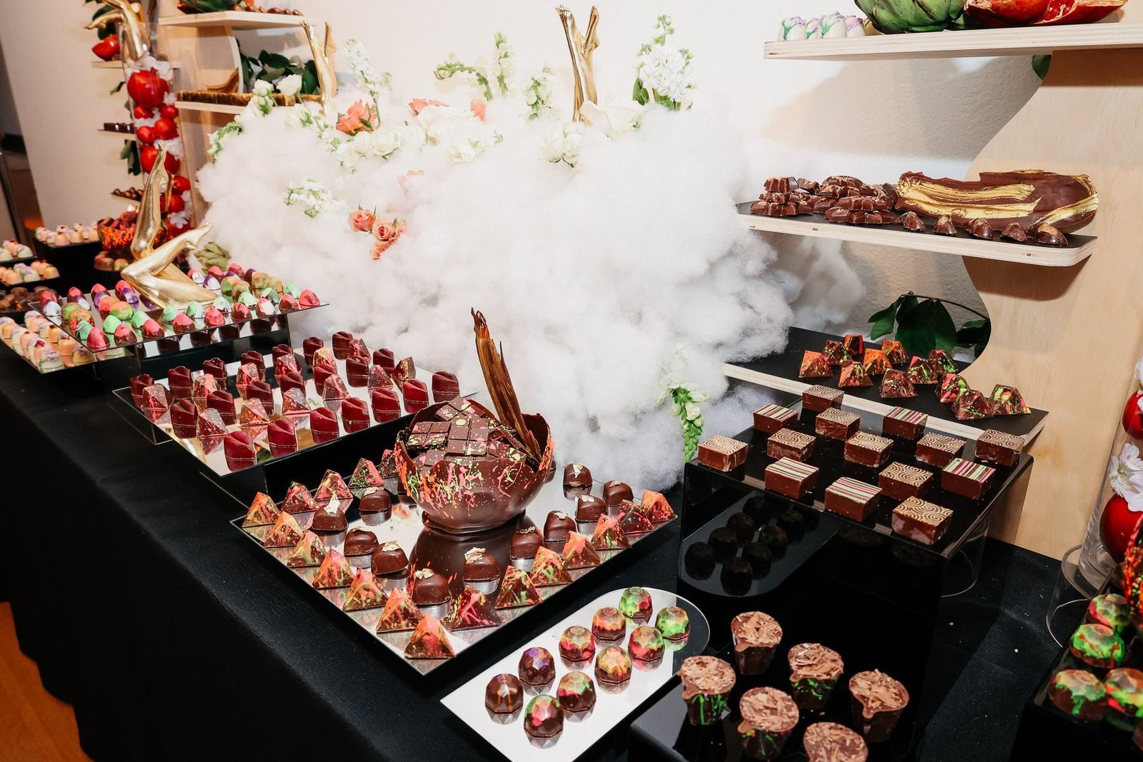 Maison Social chocolate display with bon bons and a chocolate bowl