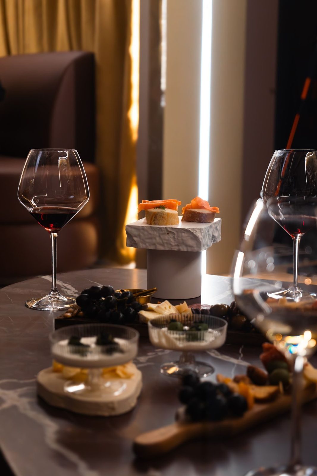 Wine, cheese and small plates set in a lounge